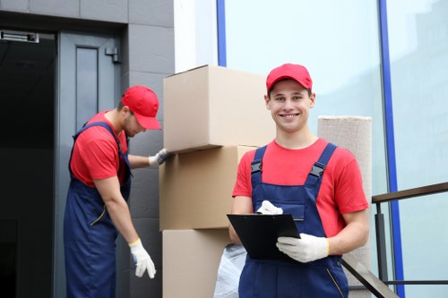 Removal team helping with a London home move outside a terraced property