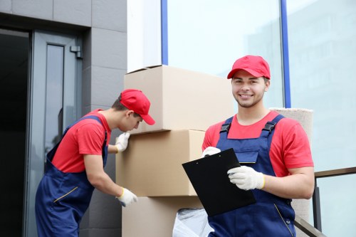 Man with van loading furniture for a local move in London