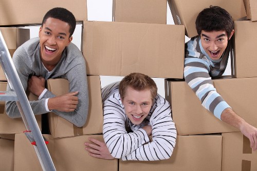 Packing and loading household items for a London home removal