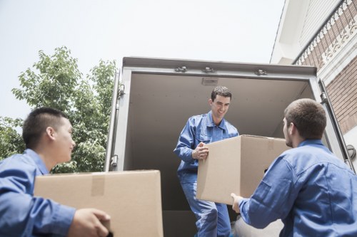 Worker assessing moving items and access risks