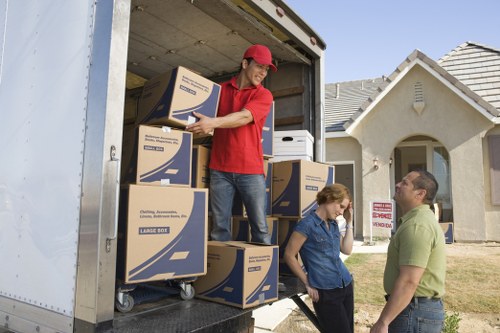 Loading boxes and household items into a moving van