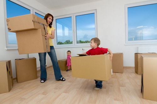 Careful wrapping and labelling of household items for moving in London