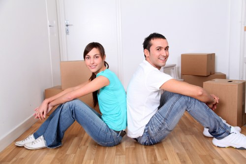 Van and mover navigating a London street for a house move