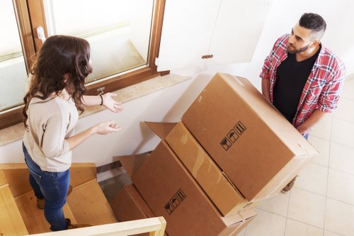 Packed boxes and moving supplies prepared for a London house move