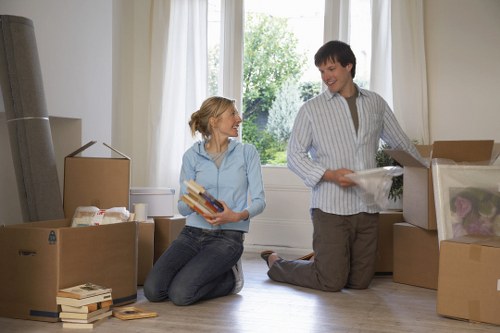 Man and van team loading furniture for a city move