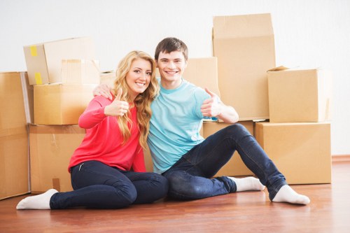 Careful loading of sofas and tables during a London furniture collection