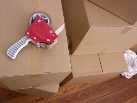 Movers planning a flat relocation in London with staircase access