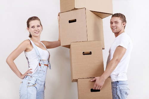 Team handling furniture in a London flat with stairs