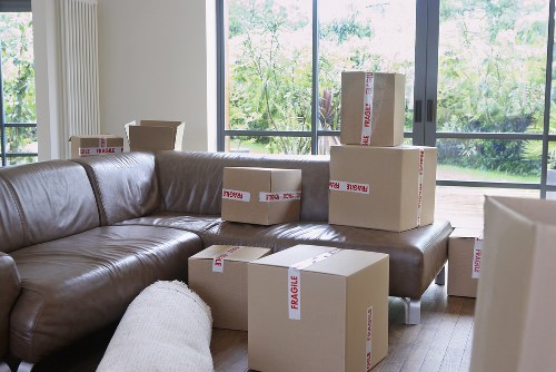 Packed office boxes and desks ready for a commercial move in London